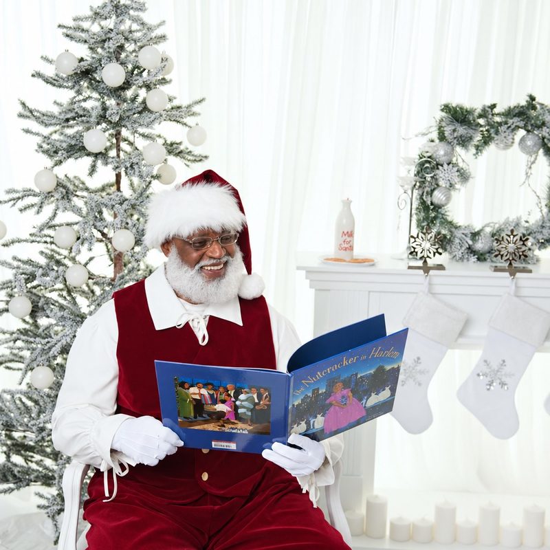Polar Express with Santa: Santa reading a storybook beside a snow-flocked tree and white stockings